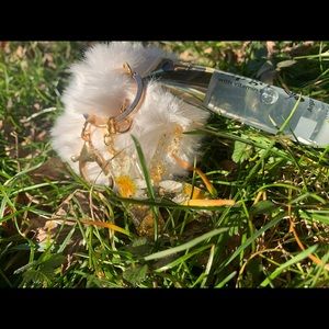 Initial letter keychain with puffball and lipgloss
